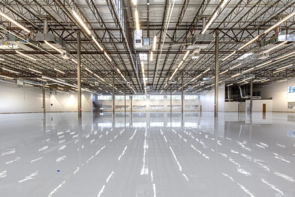Spacious polished commercial facility with glossy epoxy flooring