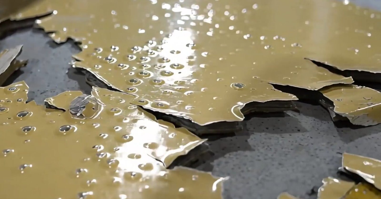 Peeling epoxy coating with moisture droplets and widespread blister damage