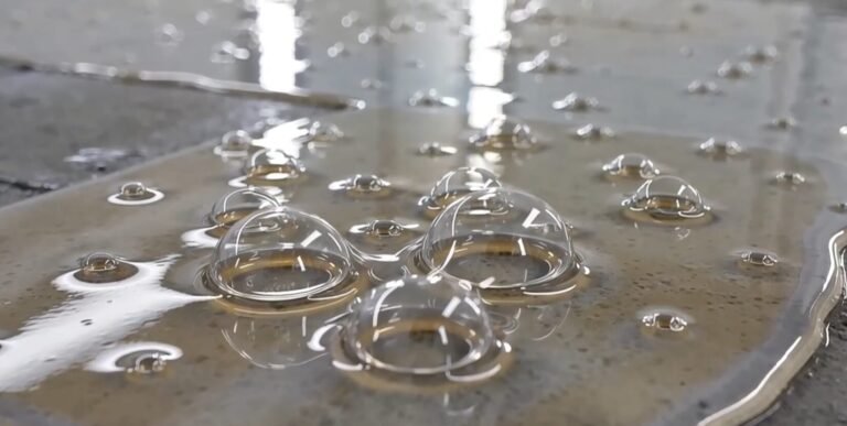 Large air bubbles and blisters forming beneath an epoxy floor coating